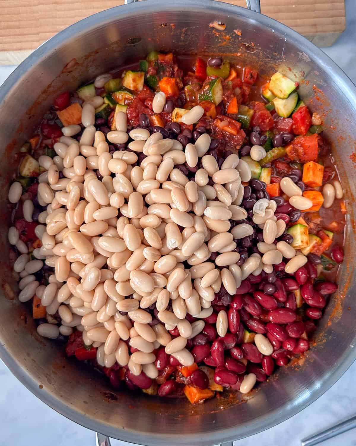 Add the three beans into the chili.