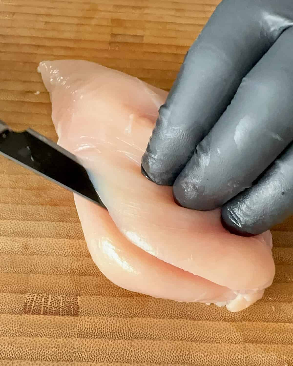 Using a sharp knife, carefully slice along the side of each breast to butterfly it.