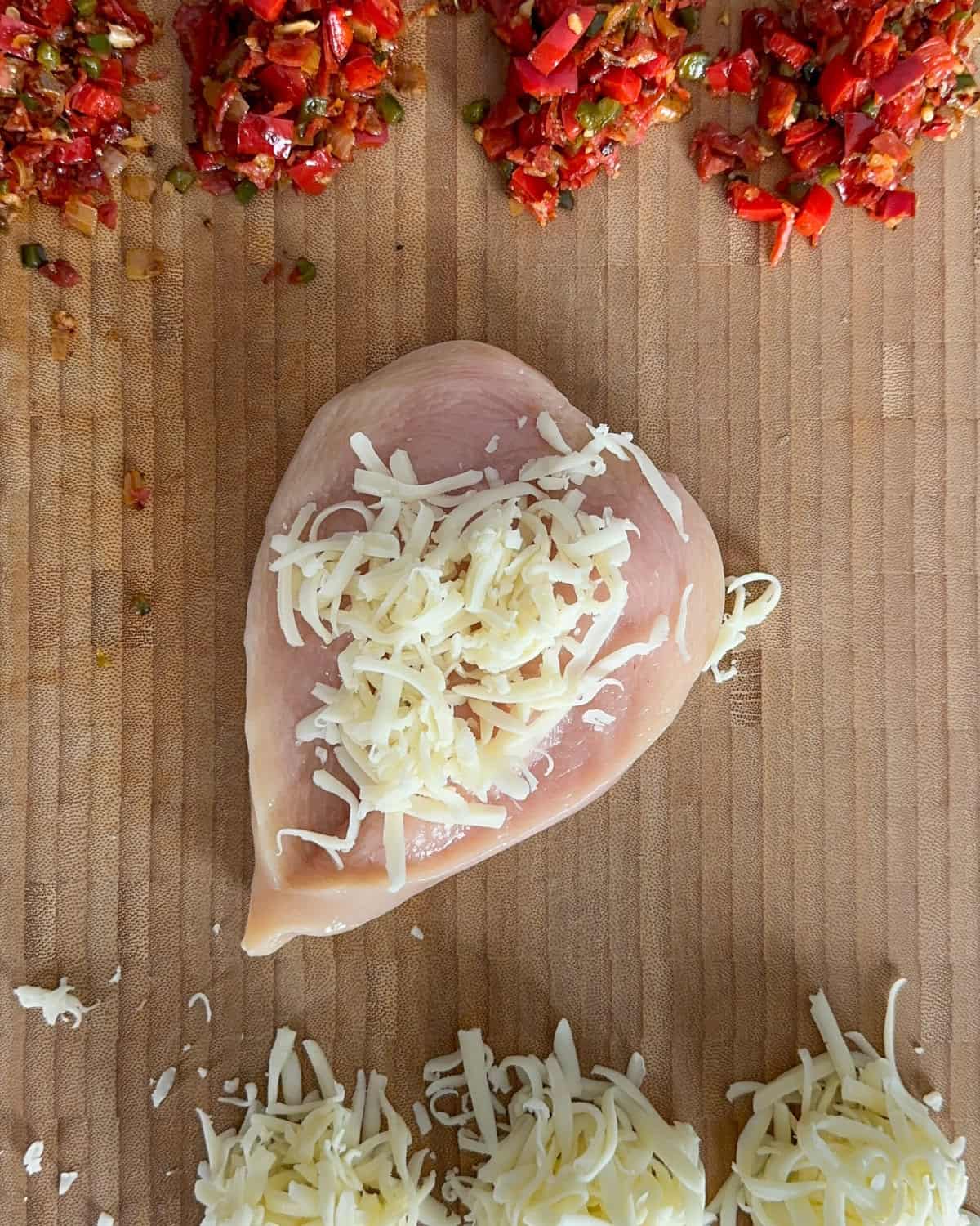Fill the opening of each breast with ¼ cup of mozzarella.