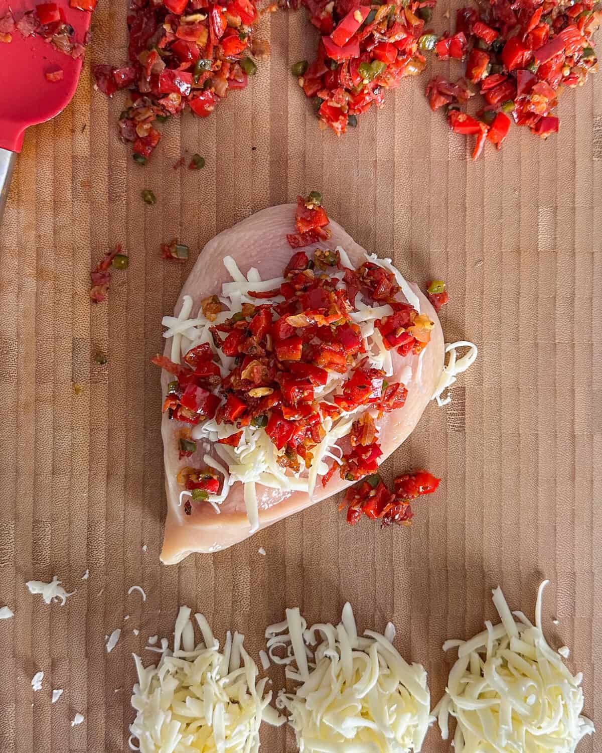 Add ¼ cup of the vegetable-pepperoni mixture on top of the cheese.