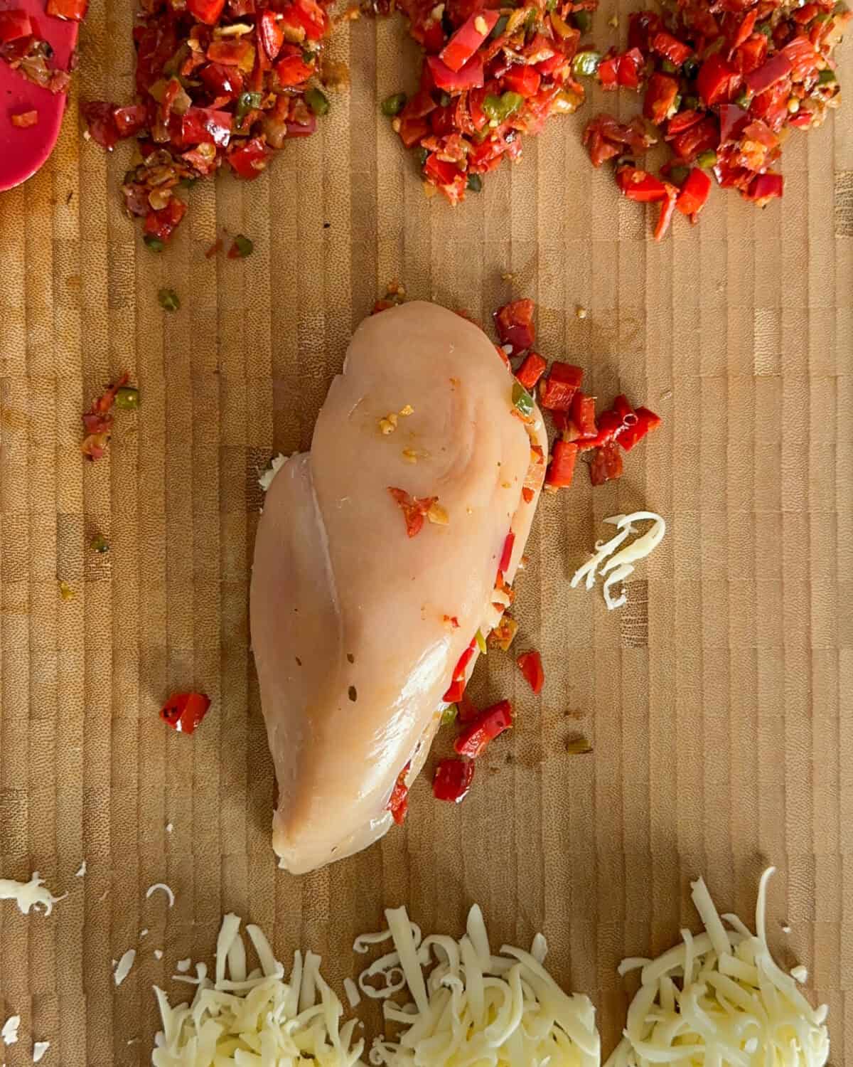Gently fold each breast closed, ensuring the Chicken Pizzaiola stuffing is securely enclosed.