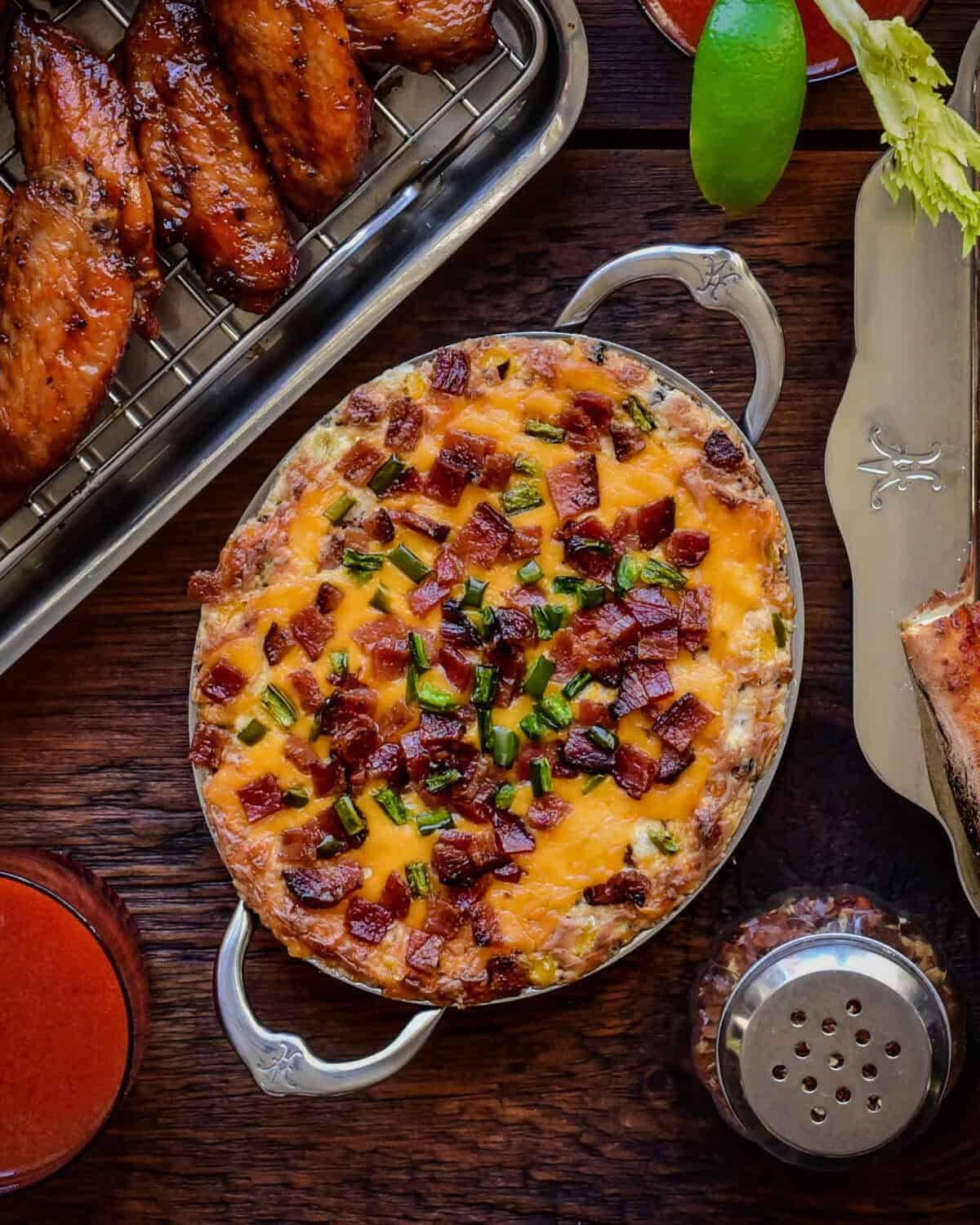 A baked jalapeno popper dip in a small oval au gratin.