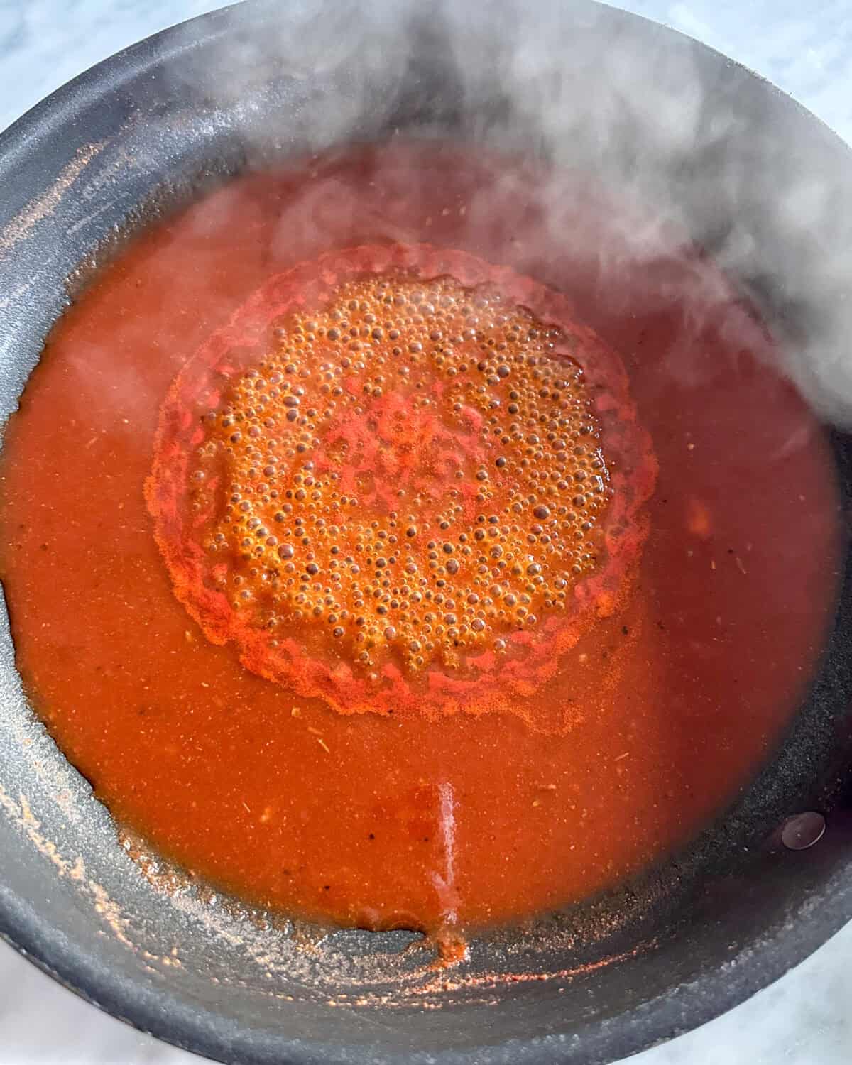 Bring the sauce to a simmer.
