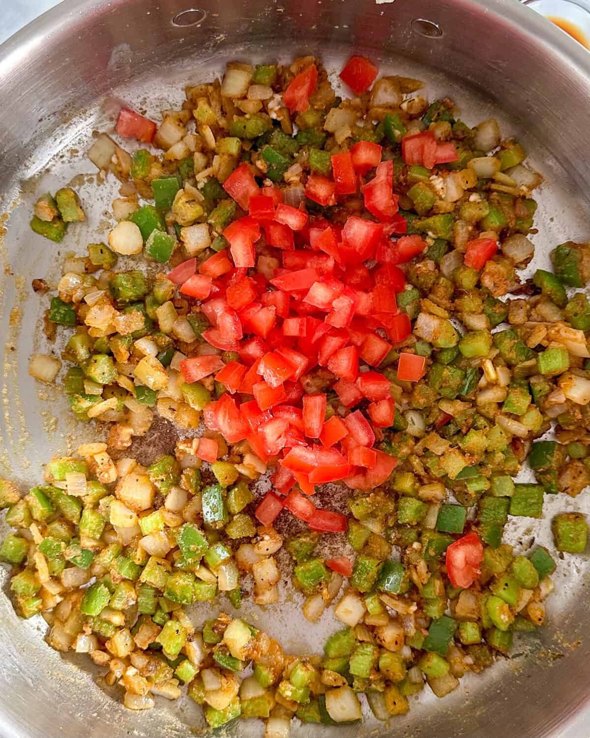 Add the diced tomatoes to the shrimp éouffée sauce.