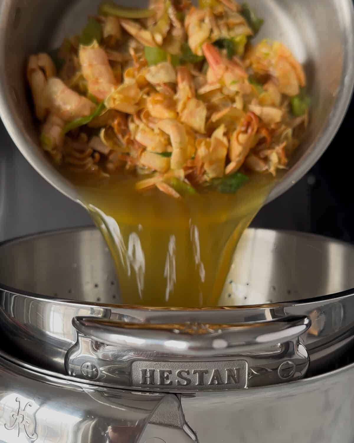 Strain the shrimp stock and discard the solids.