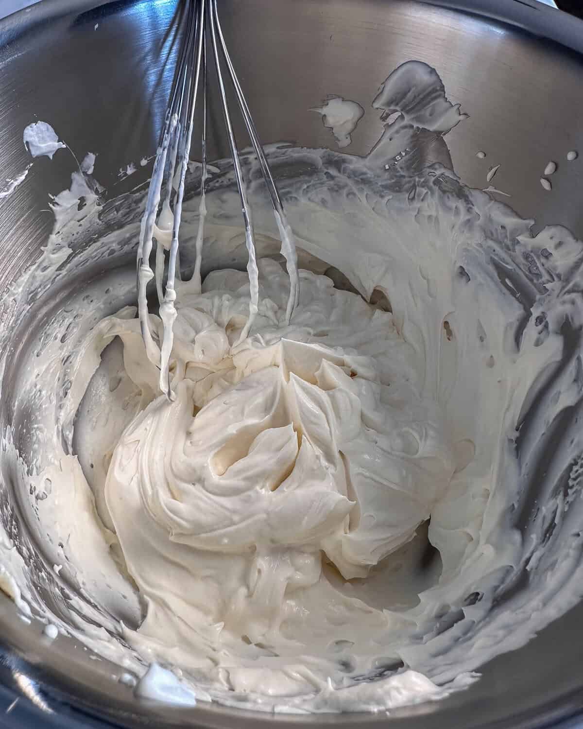 Fold the whipped cream mixture into the mascarpone until smooth.