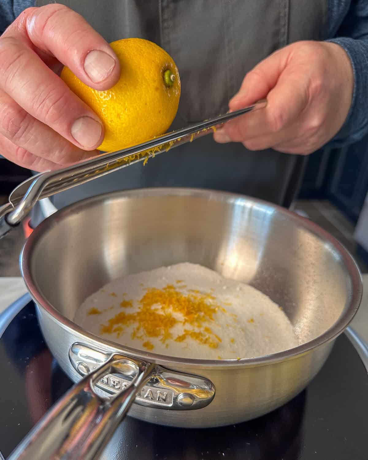 Zest the lemon into the sugar.