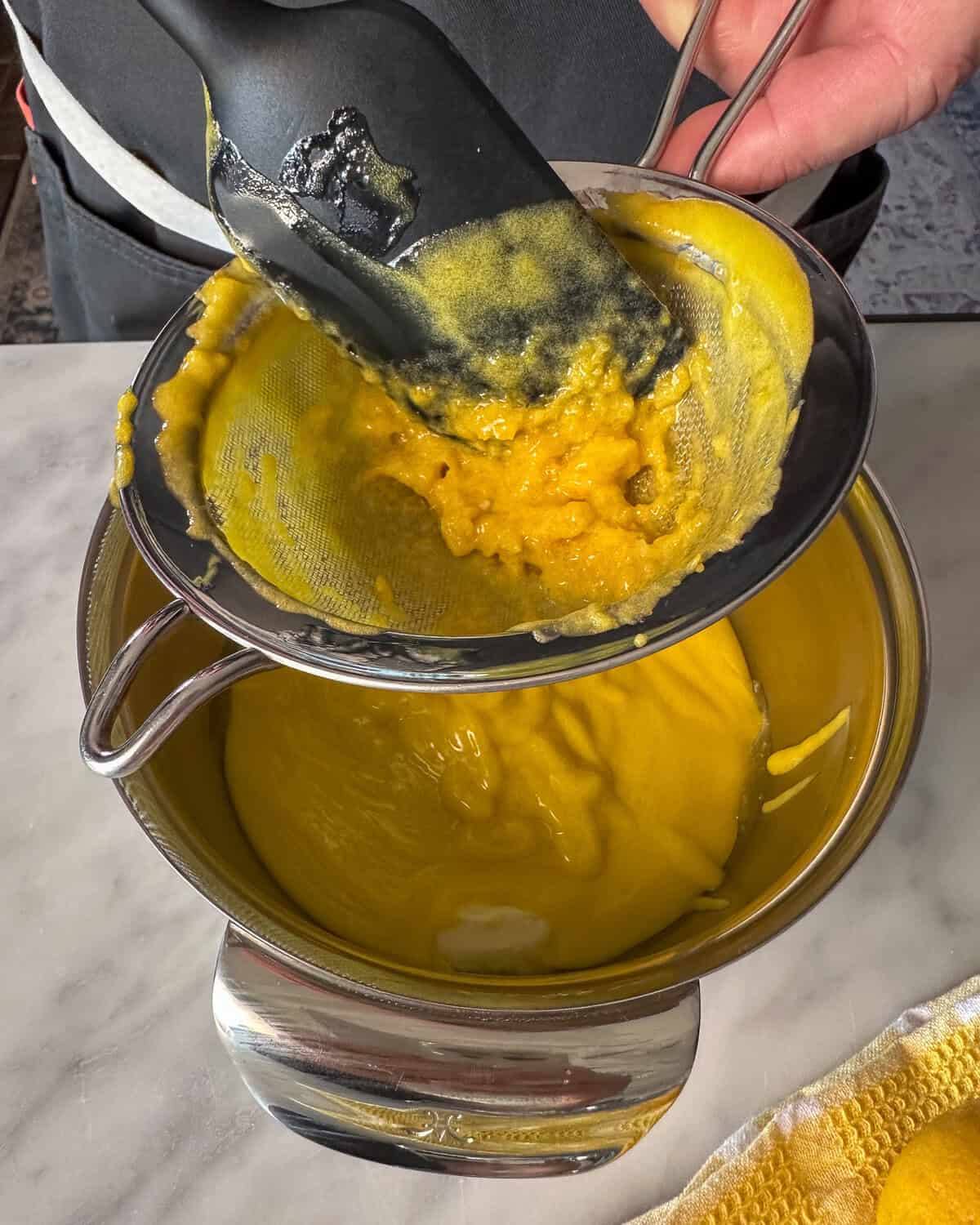 Remove from heat and strain through a fine sieve into a bowl with the butter.