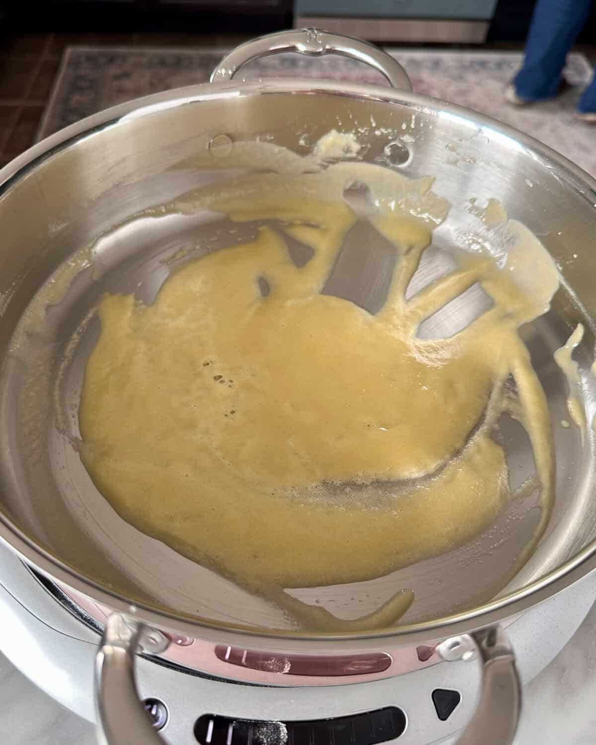Melt the butter and whisk in the flour and cook for 2–3 minutes, stirring constantly.