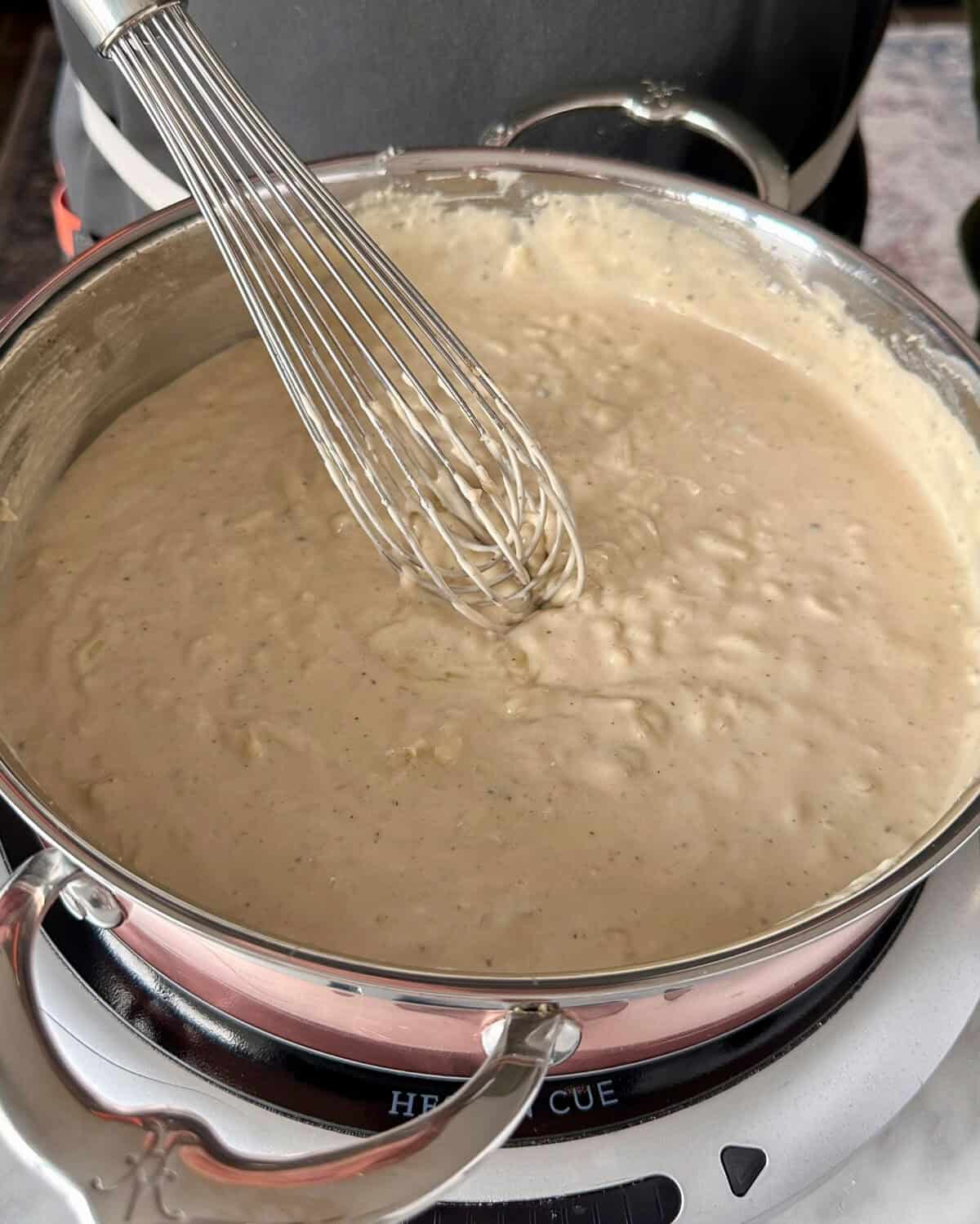 Stir in the 3 cheeses into the sauce.