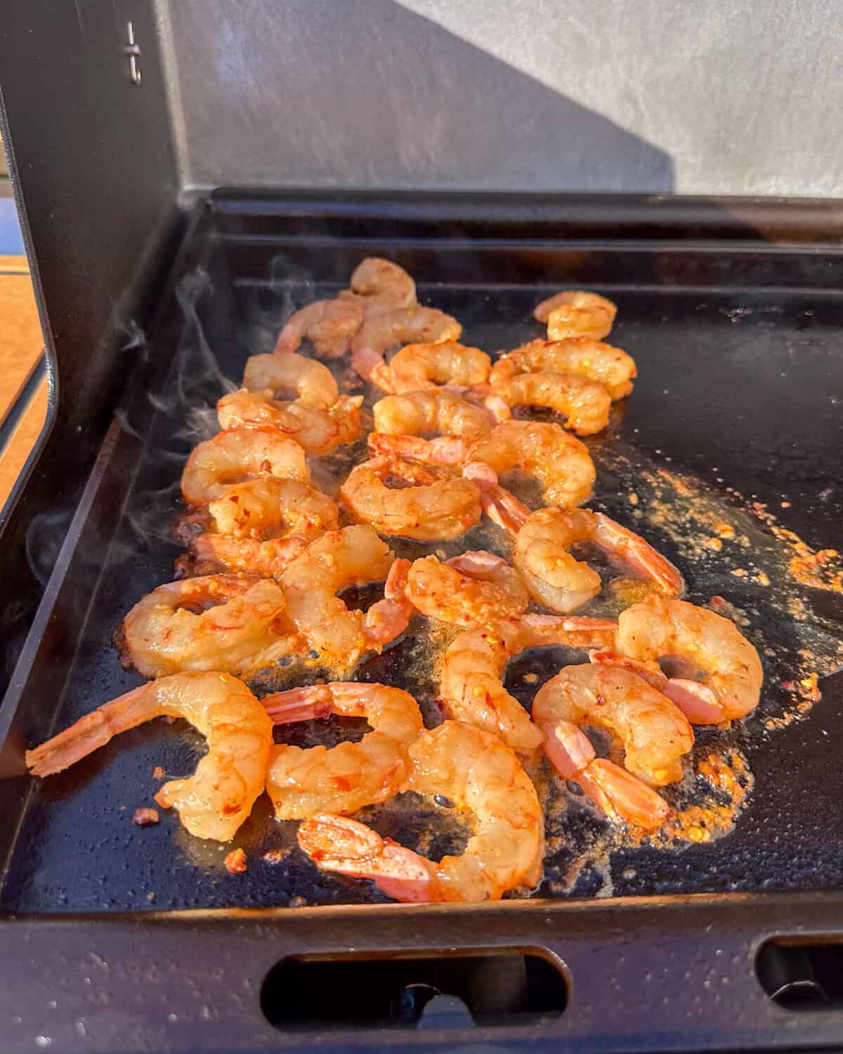 Shrimp were added to the griddle.