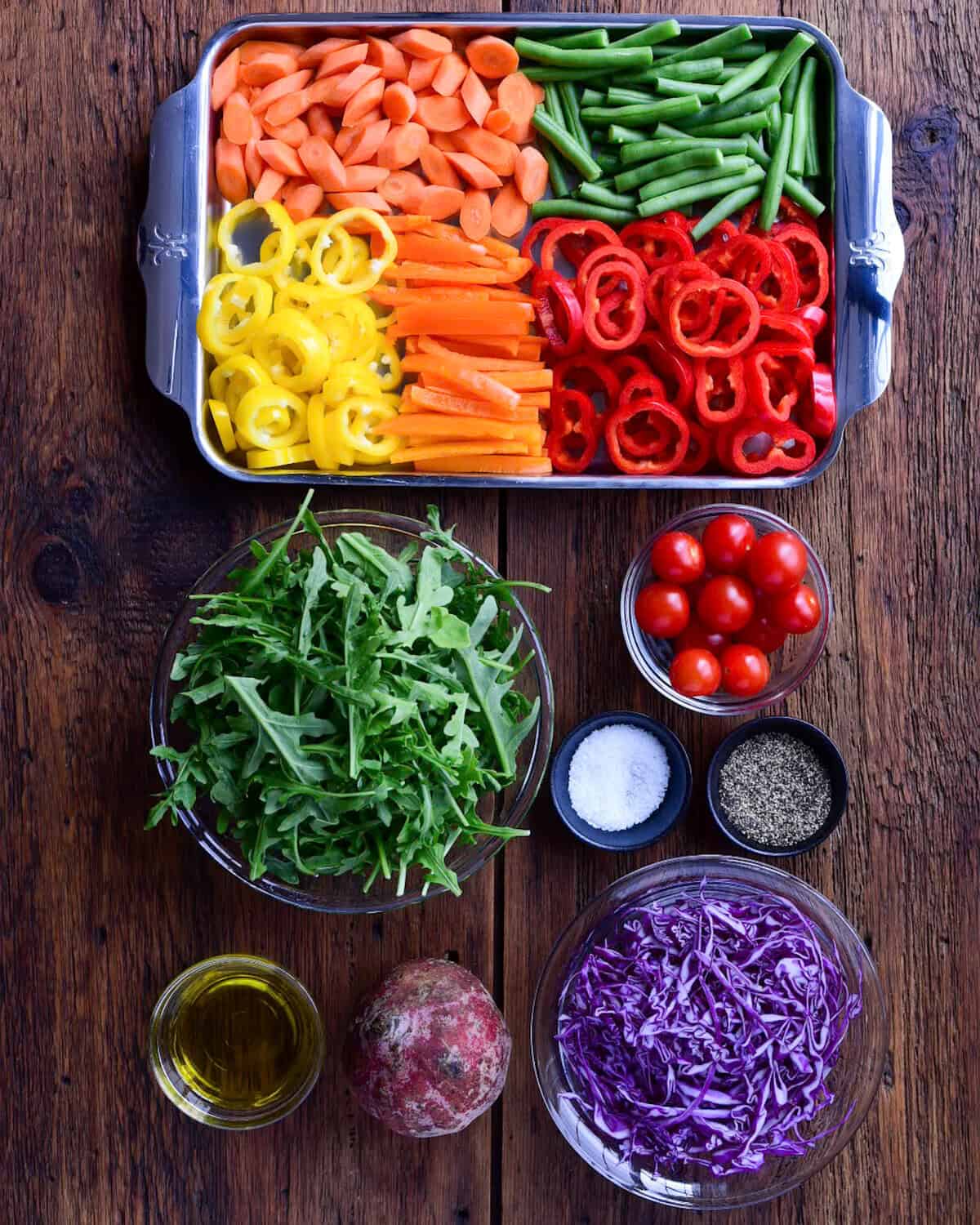 Ingredients laid out for a rainbow salad recipe.