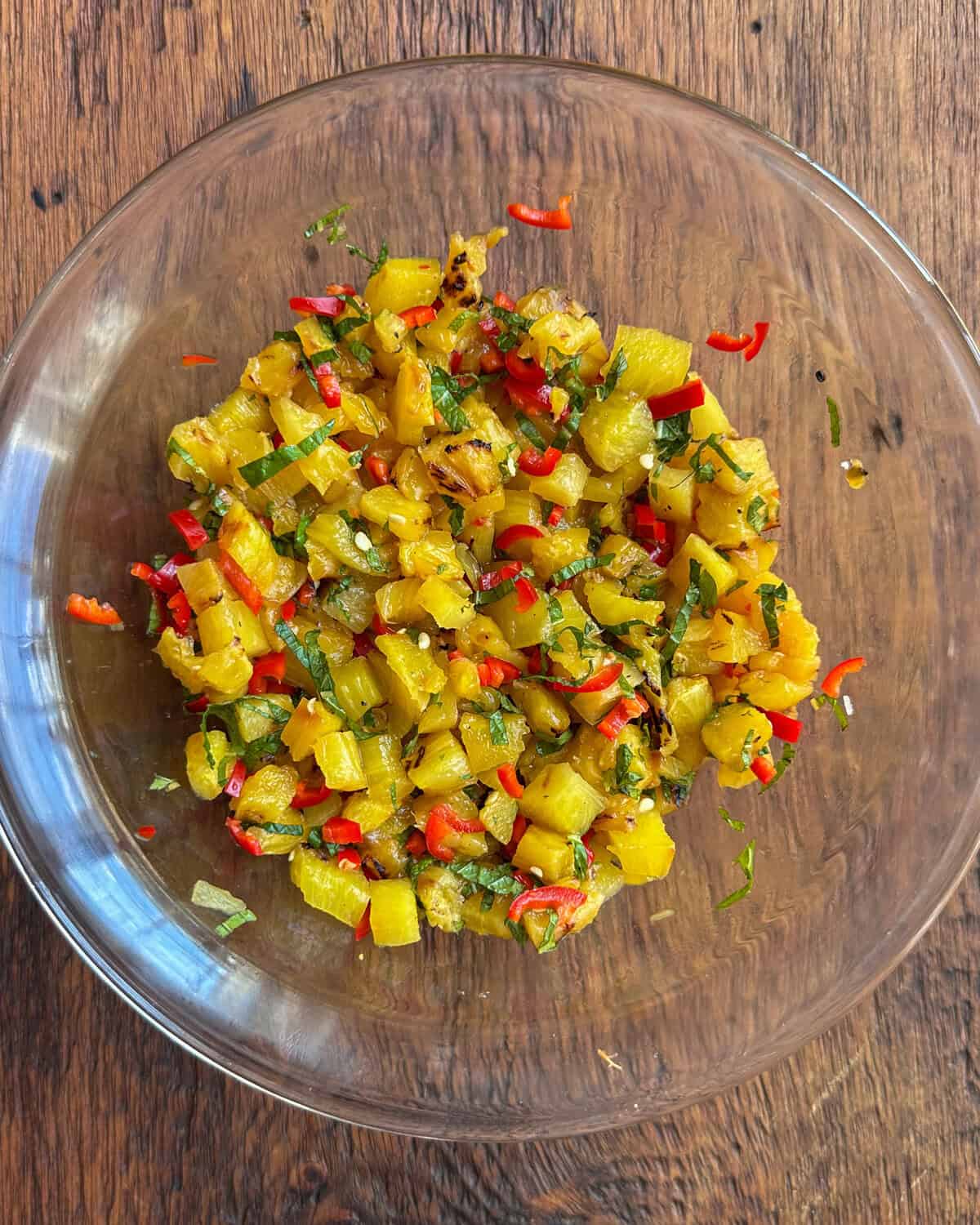 A bowl of grilled pineapple relish.