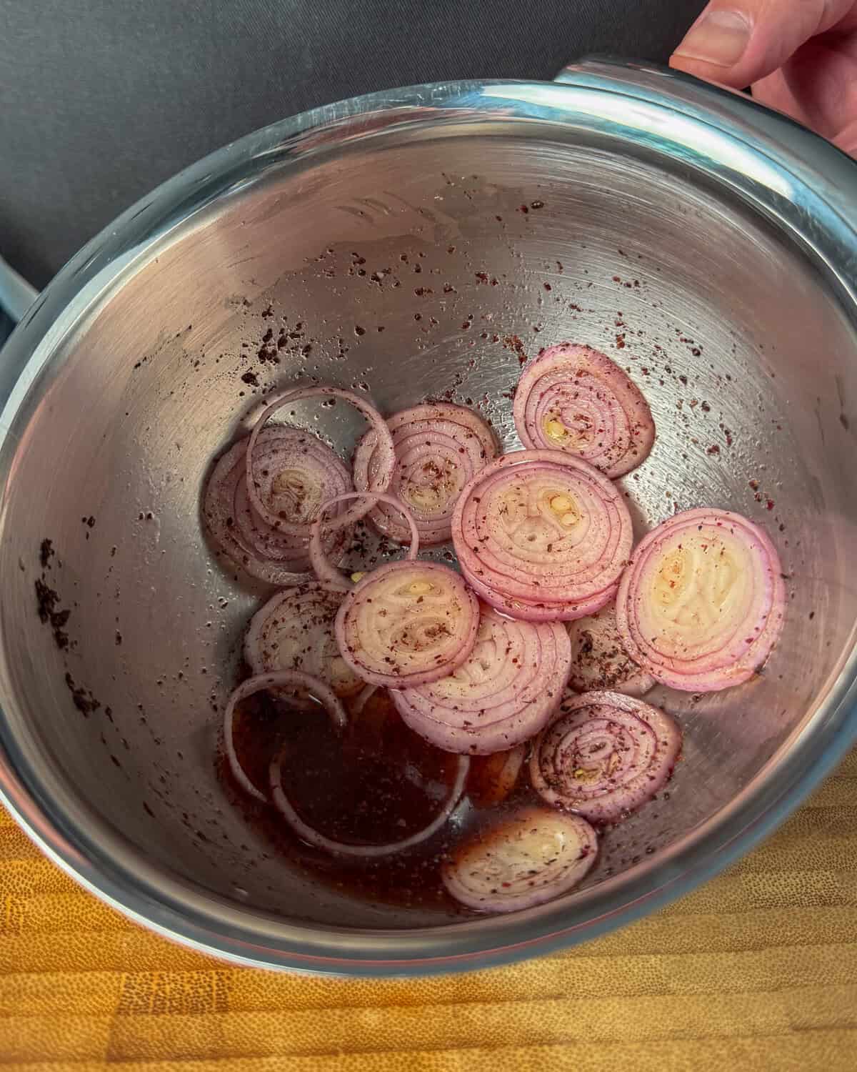 Pickling shallots in a small bowl.