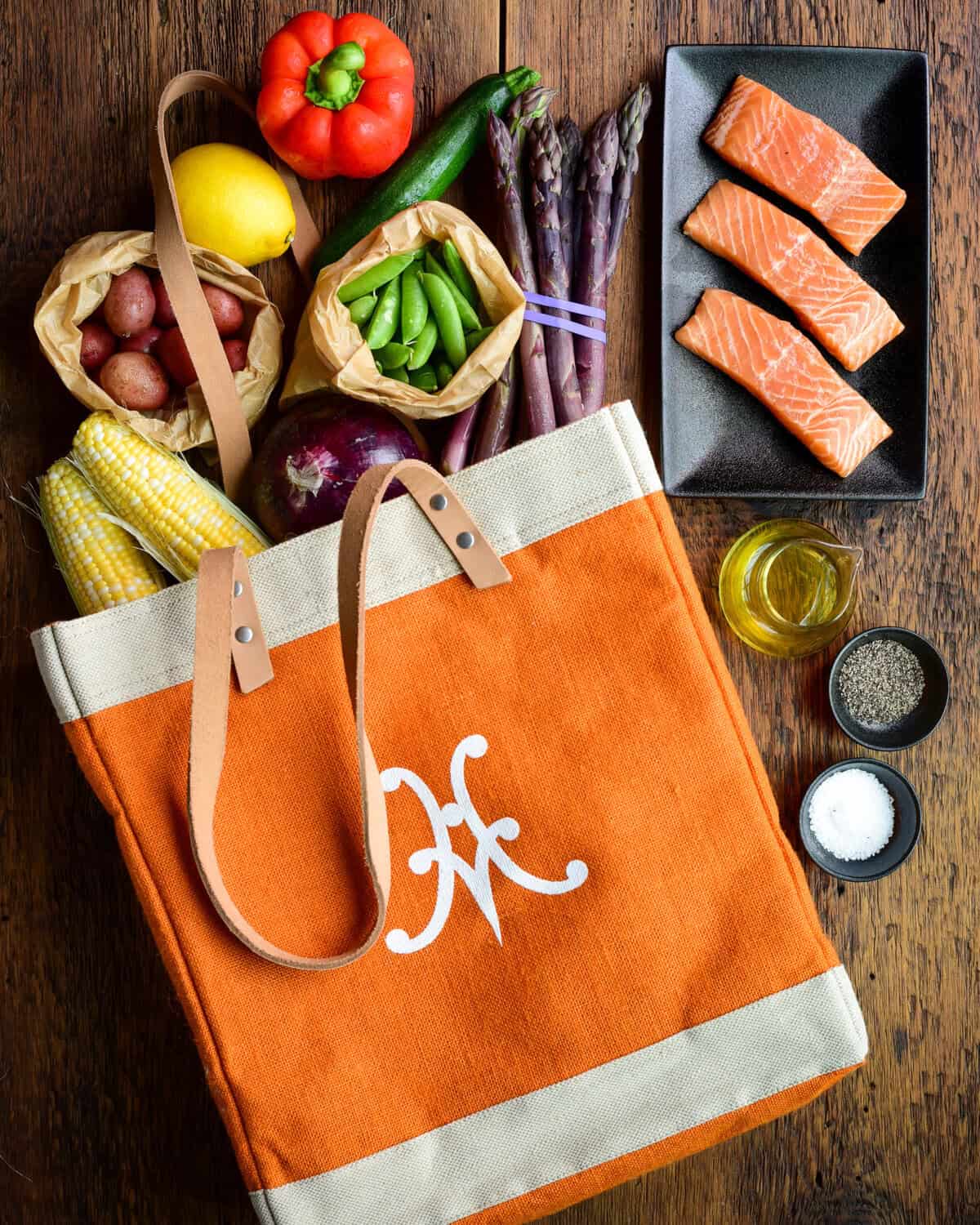 Ingredients for a summer vegetable salad with salmon.