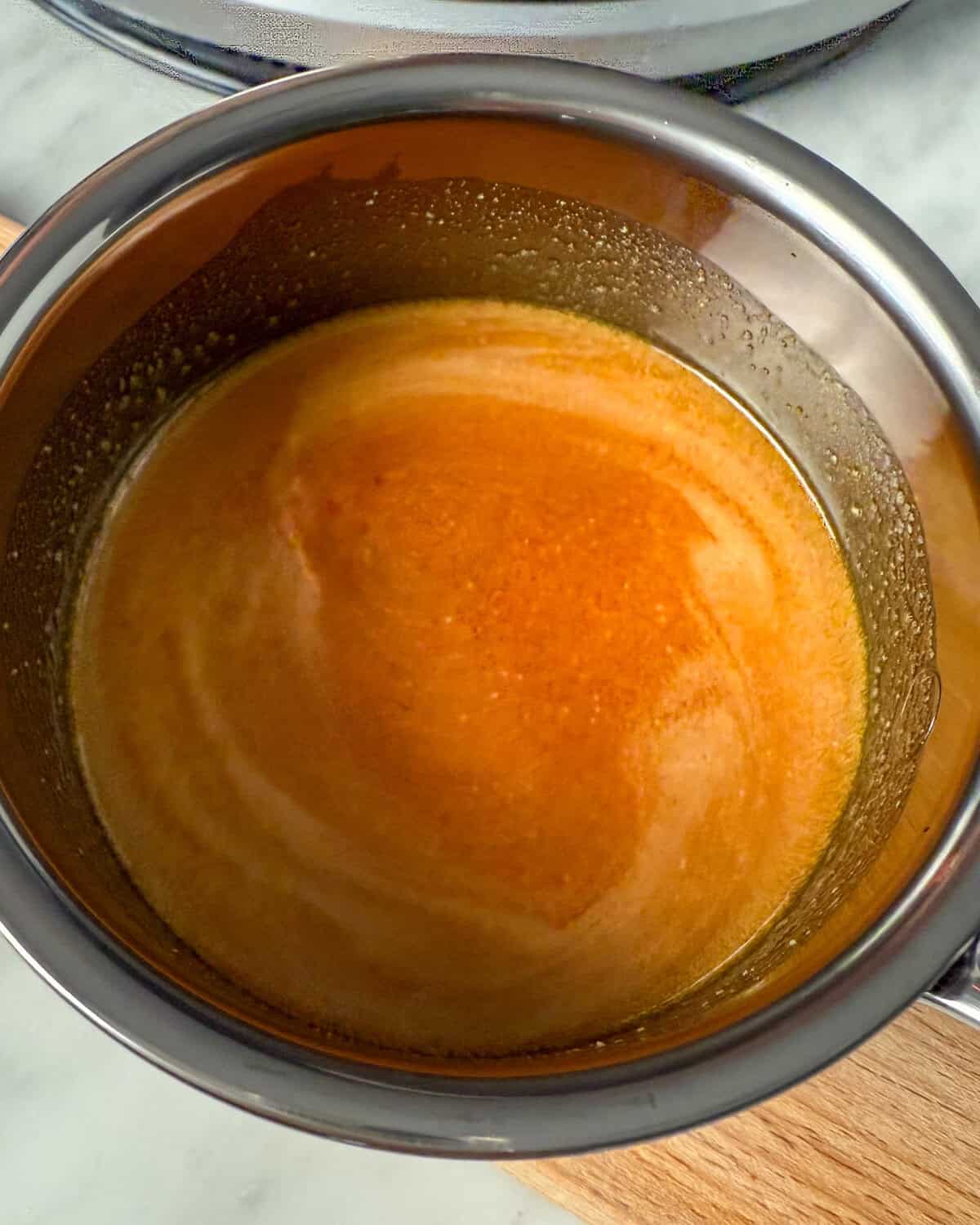 Stir in the olive oil, smoked paprika and Aleppo pepper in the brown butter.
