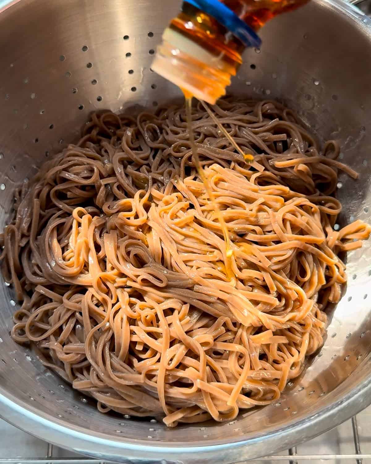 Add sesame oil to the soba noodles to prevent sticking.