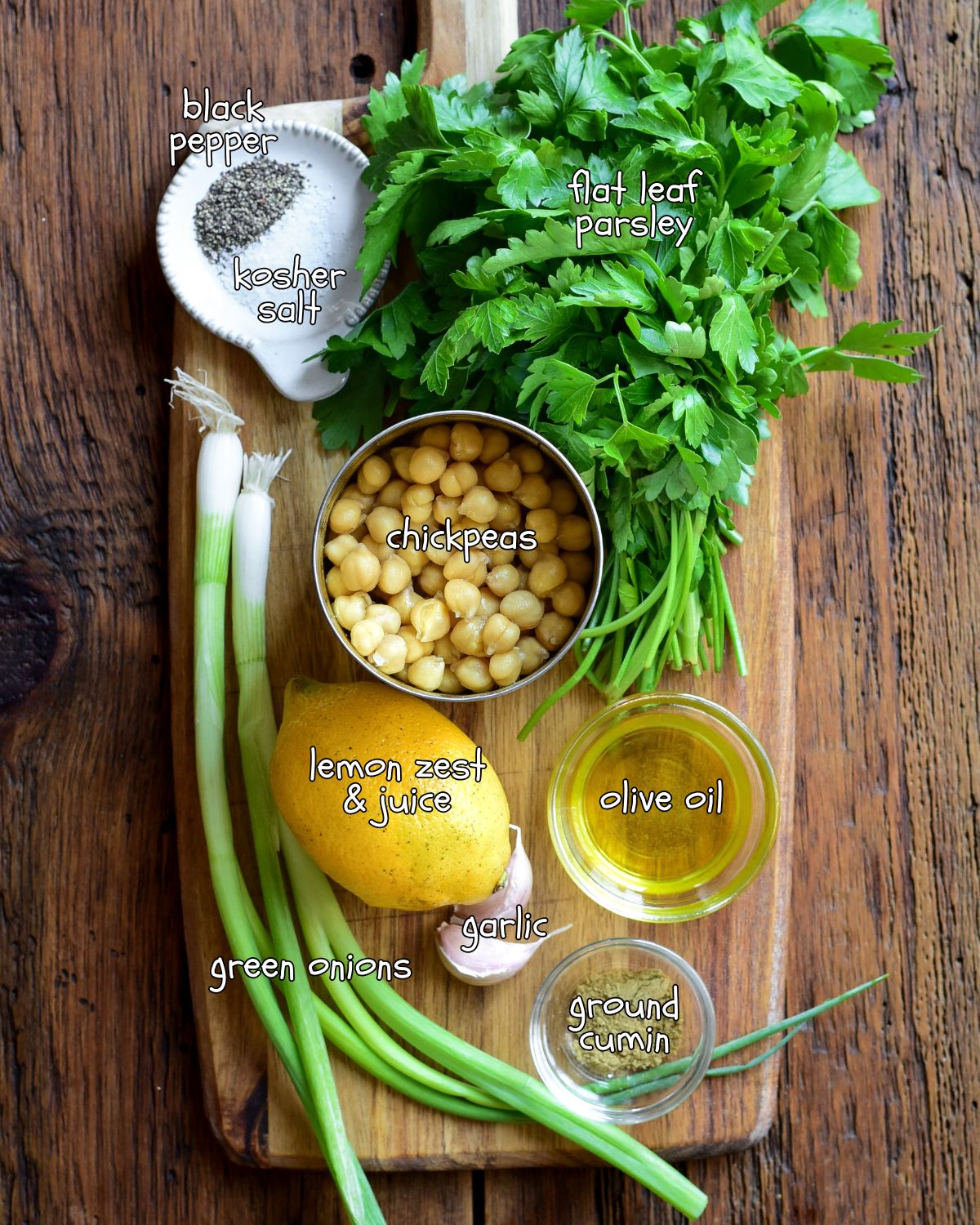 Ingredients for a chickpea parsley salad with lemon and olive oil.