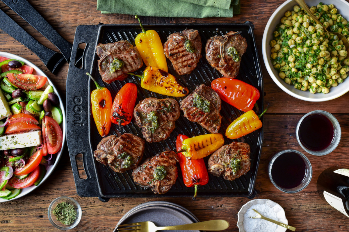Greek lamb chops and blistered peppers served with a village salad and a chickpea and parsley salad.