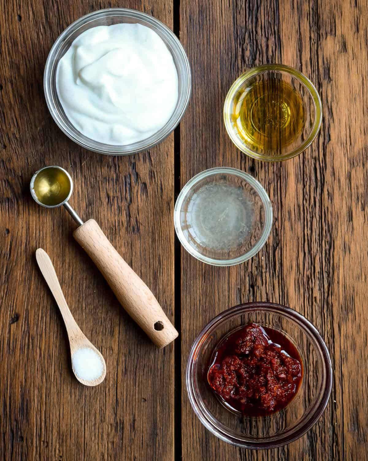 Ingredients for a spicy harissa yogurt sauce.