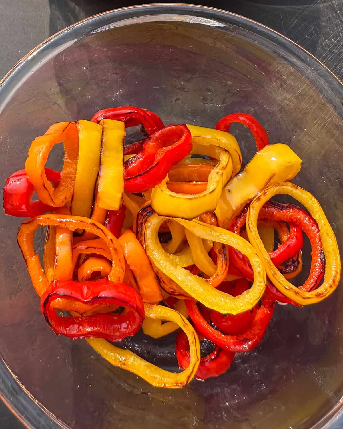 Griddled pepper rings for topping lamb smash burgers.