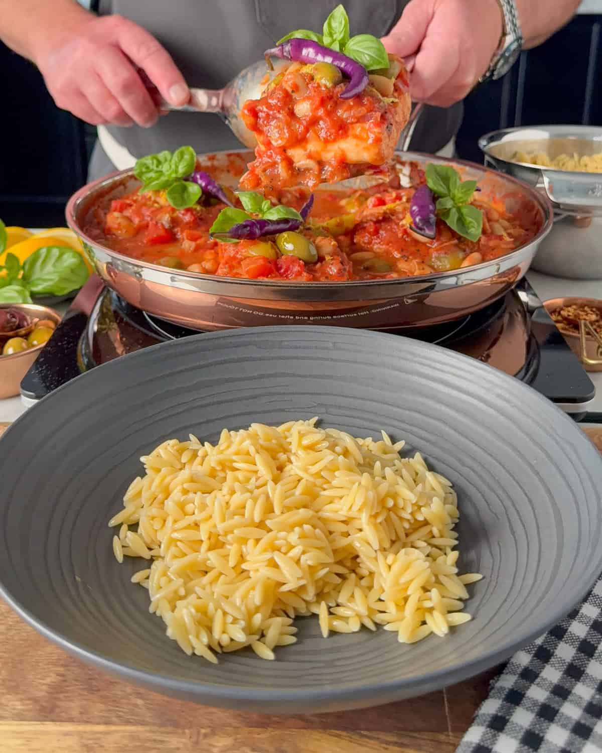 Place a portion of orzo in each bowl.