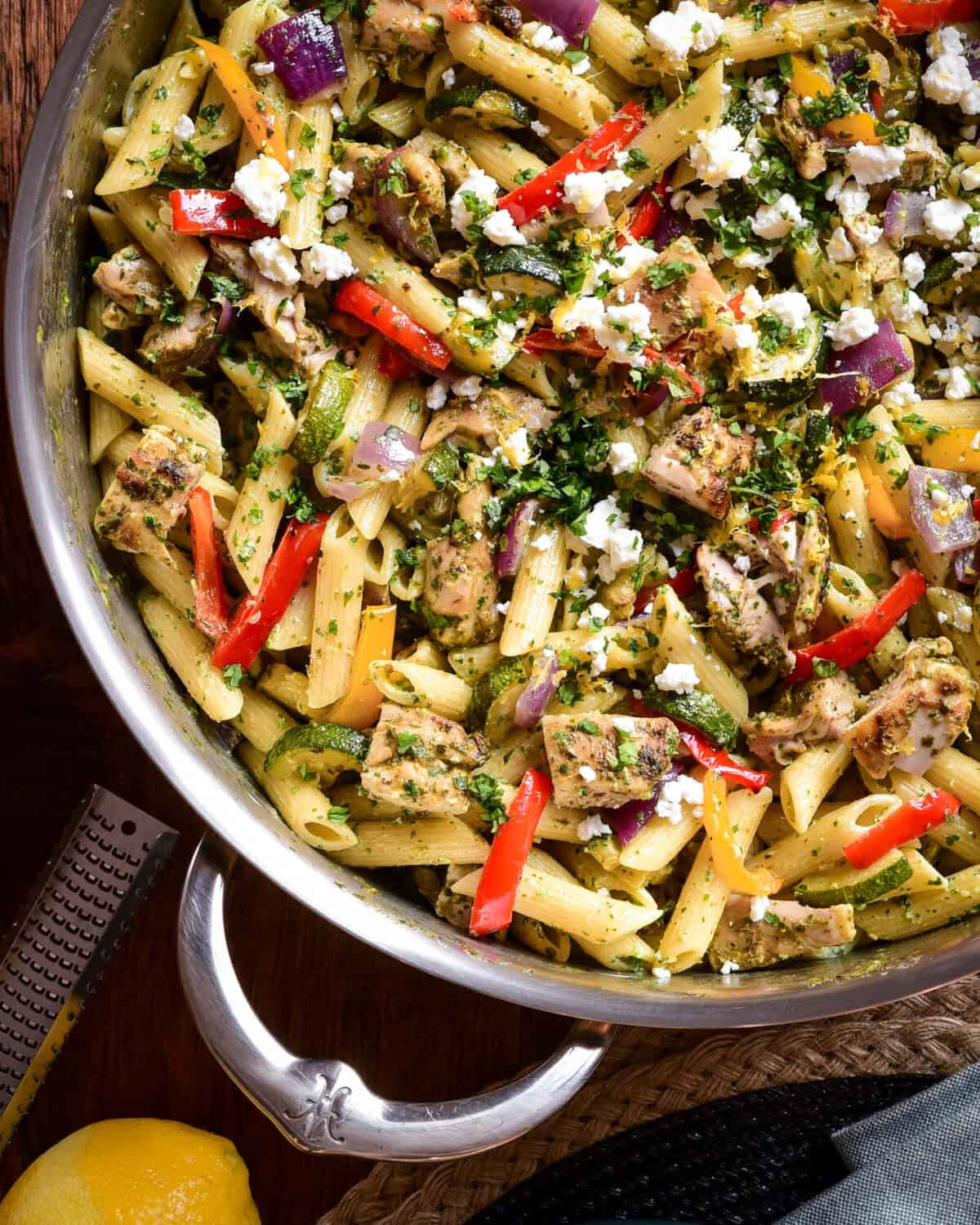 Zhoug Chicken Pasta Salad with Roasted Vegetables in a pot with a handle.