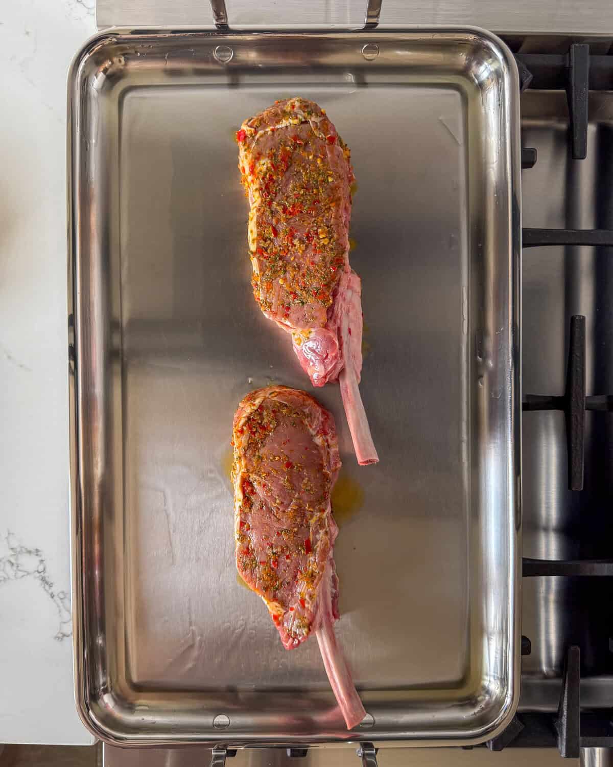 Sear the veal chops on all sides on a griddle or large skillet.