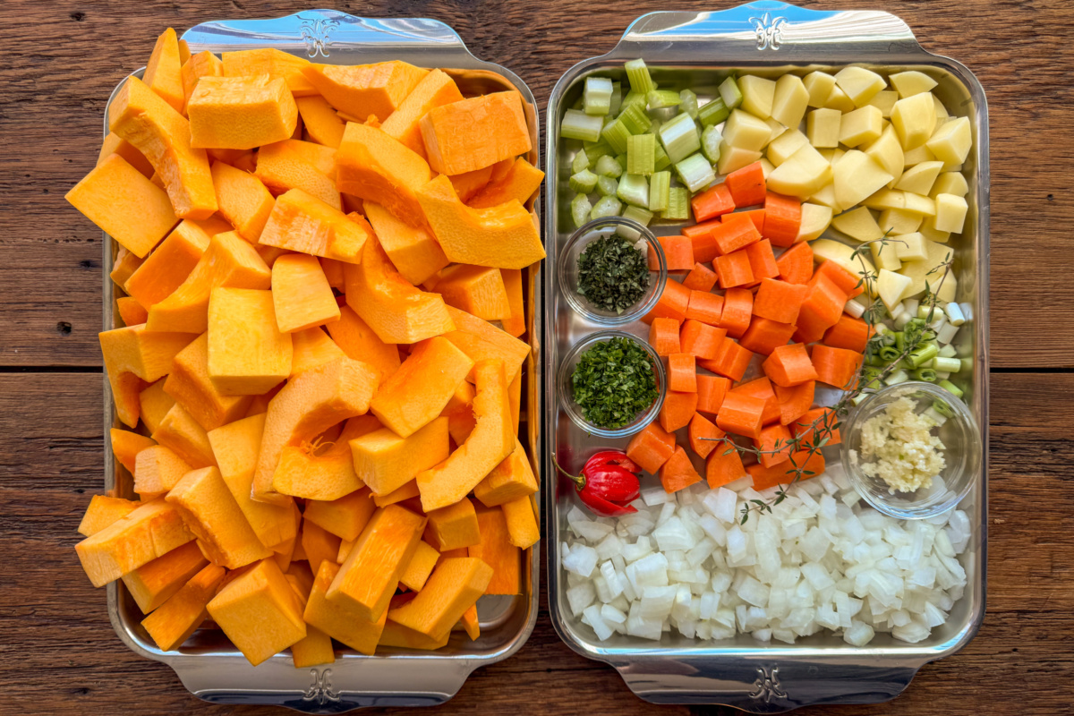 Prepped and chopped vegetables for a pumpkin with coconut milk soup.