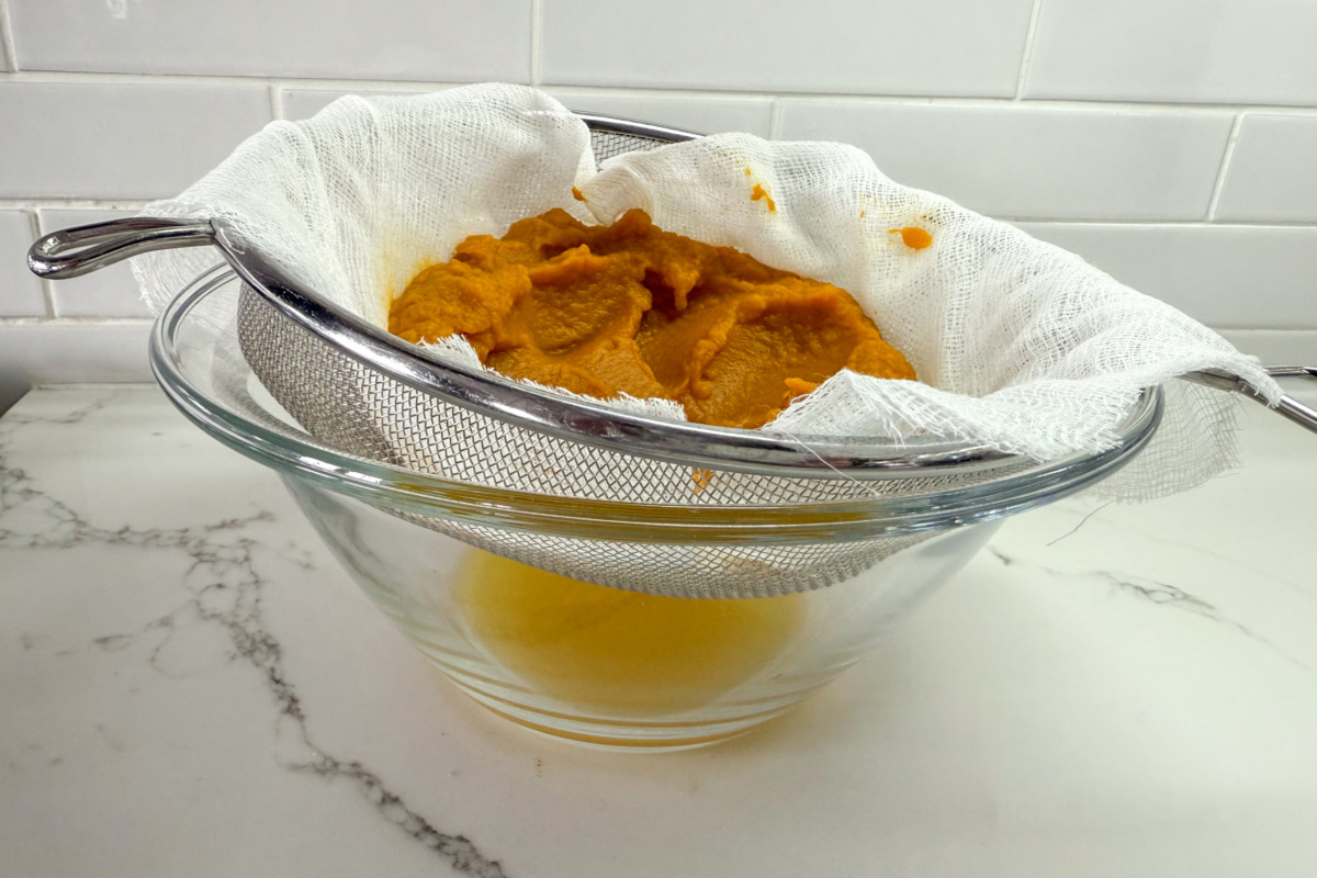 Place the purée in a cheesecloth-lined sieve and let it drain.