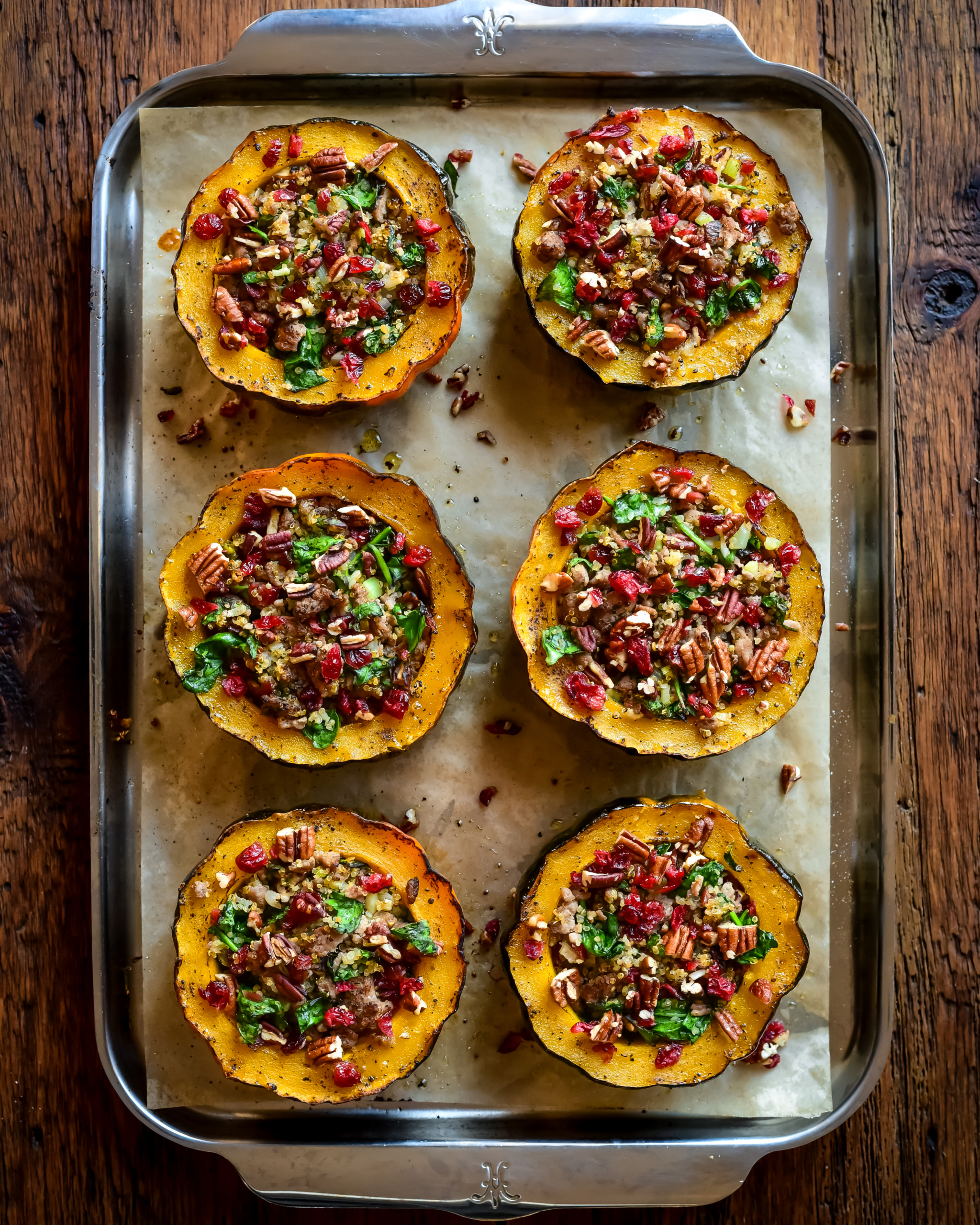 Six ground turkey stuffed acorn squash with pecans and cranberries.