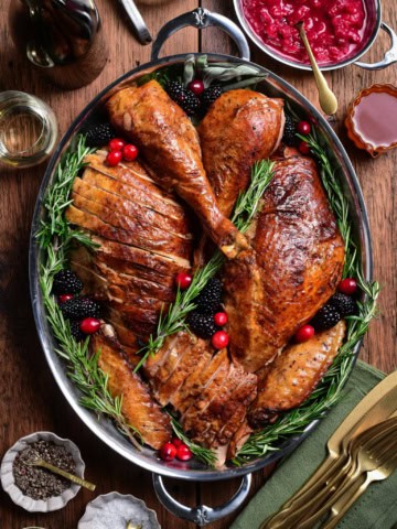 A festive sliced Tuscan turkey on a platter.