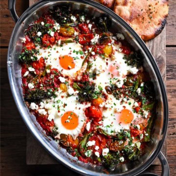 A Cherry Tomato & Broccolini Shakshuka with four eggs.