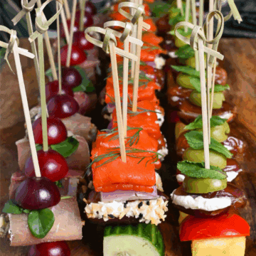 Rows of festive skewer appetizers with dates.
