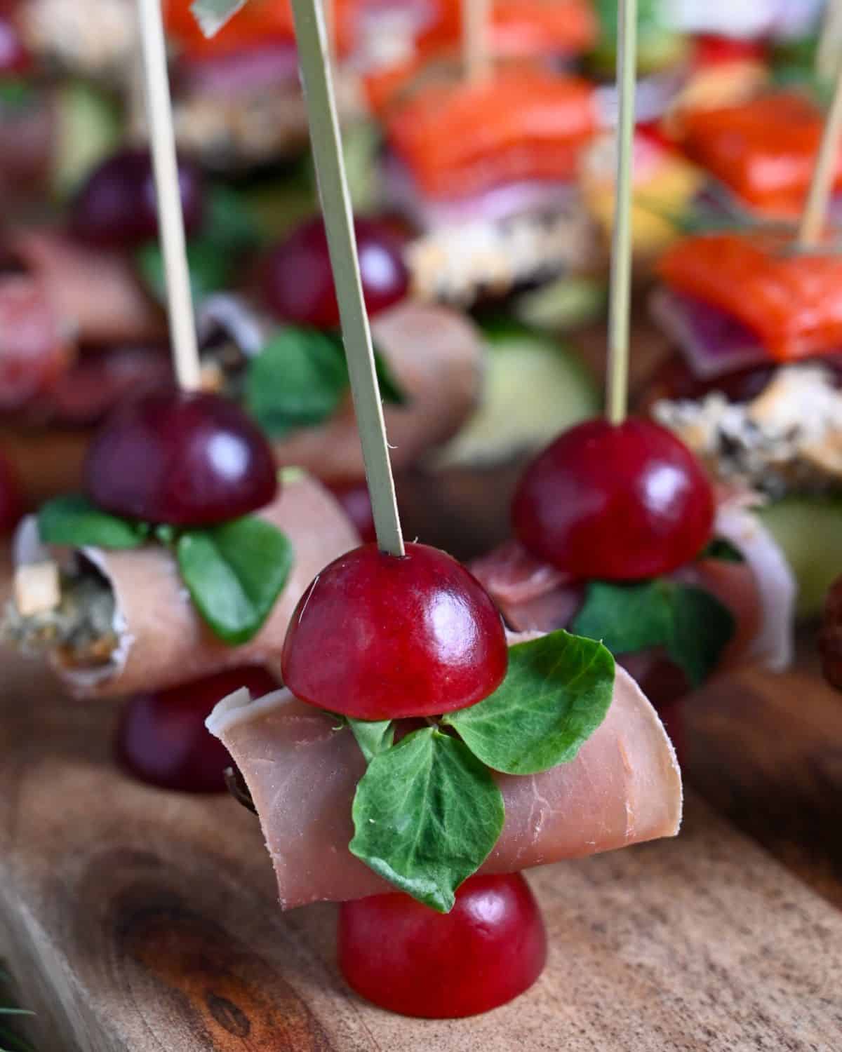 A close-up of Blue Cheese, Prosciutto & Date Skewers
