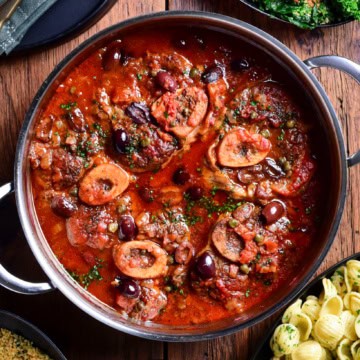 A pot of braised veal osso buco with Puttanesca sauce and served with orecchiette, garlicky rapini and lemon-parsley breadcrumbs.