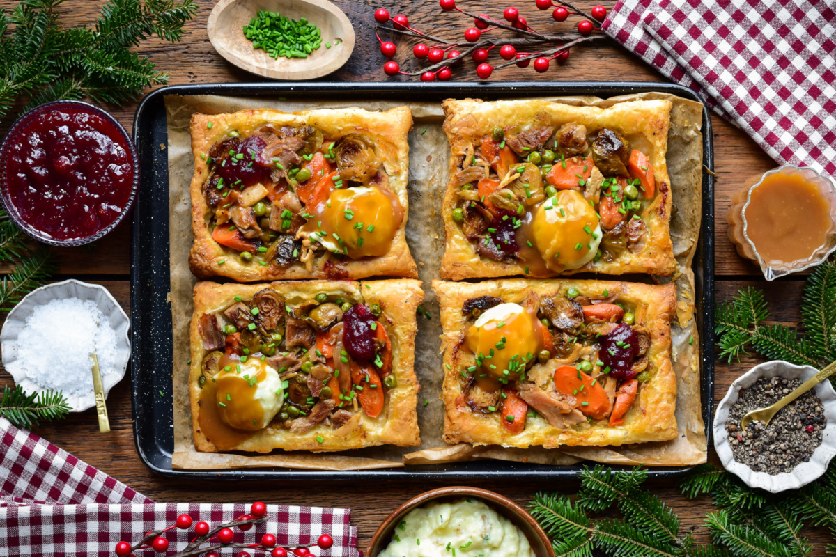 Four savory, viral upside down puff pastry tarts served with mashed potatoes, gravy and cranberry sauce.