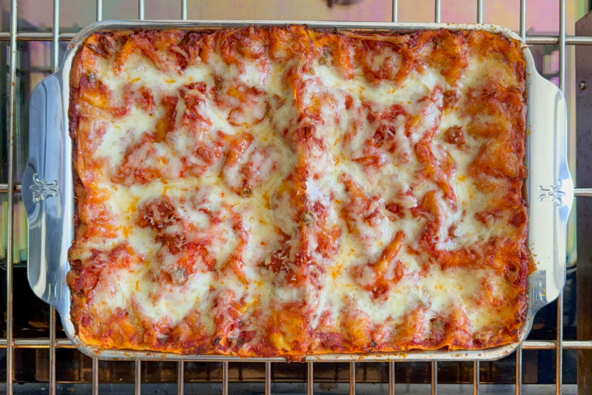 A baked sausage and beef lasagna made with fresh pasta.