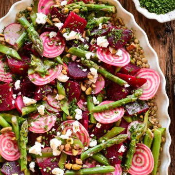 A colourful spring beet and lentil salad. Loaded with crisp asparagus, candy cane beets and feta.