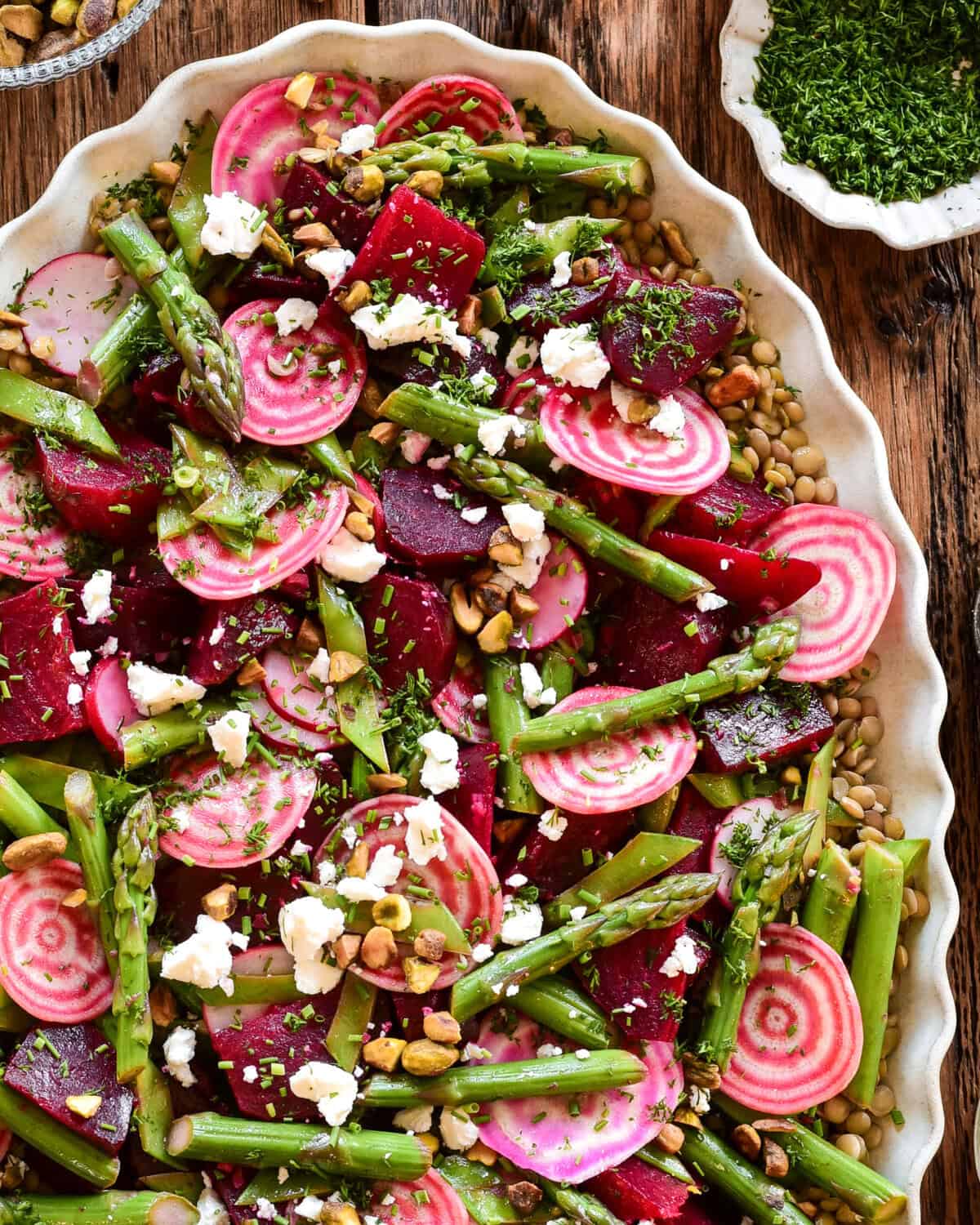 A colourful spring beet and lentil salad. Loaded with crisp asparagus, candy cane beets and feta.