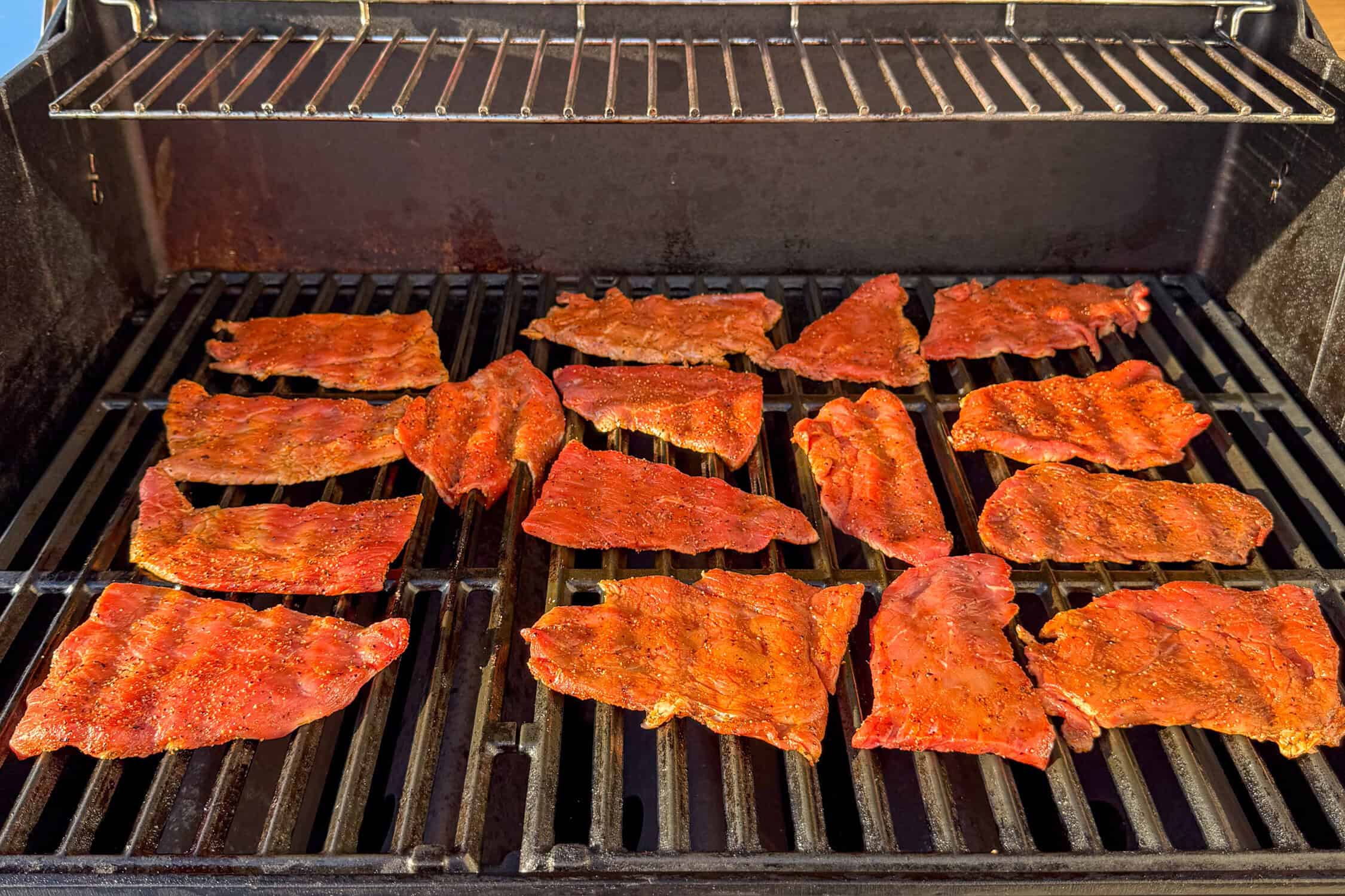Place the veal cutlet halves on the grill for sandwiches.