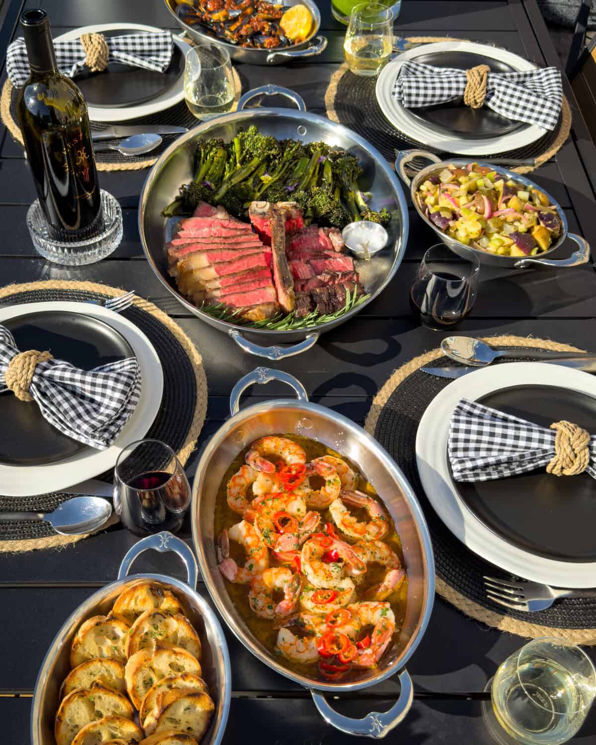 An alfresco table with a surf and turf menu.