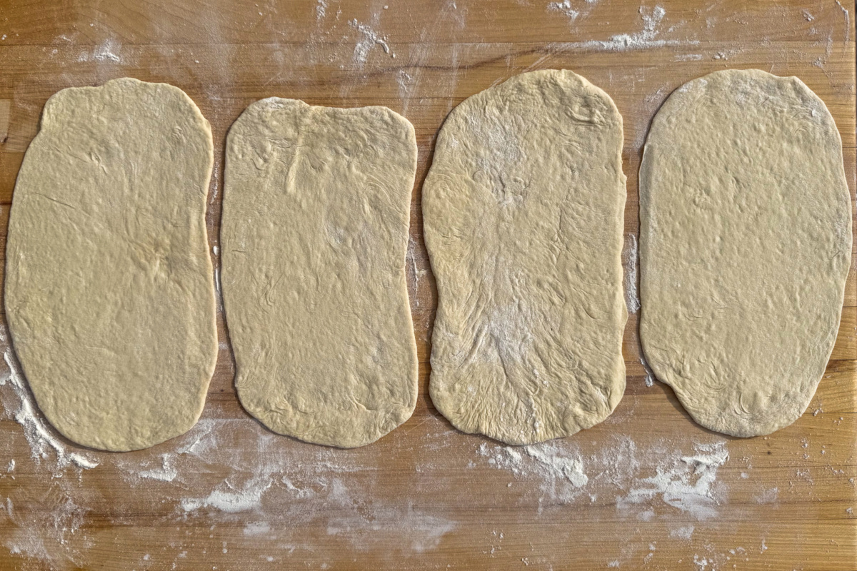 Divide the dough in four and roll out four flatbreads.
