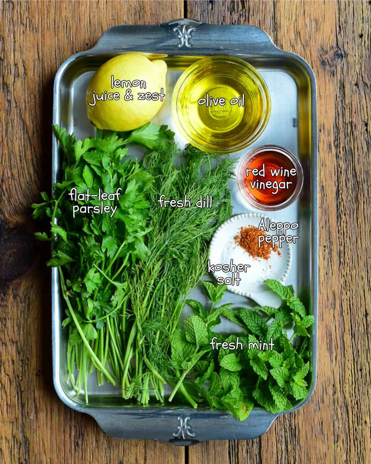 Ingredients for a lemon-herb oil recipe.