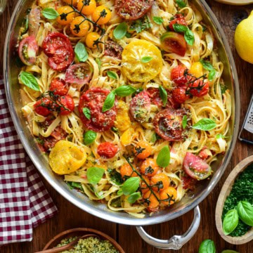 A large oval au gratin filled with a roasted heirloom tomato pasta with lemon-garlic panko and basil. Served with extra panko, lemon zest and extra herbs.