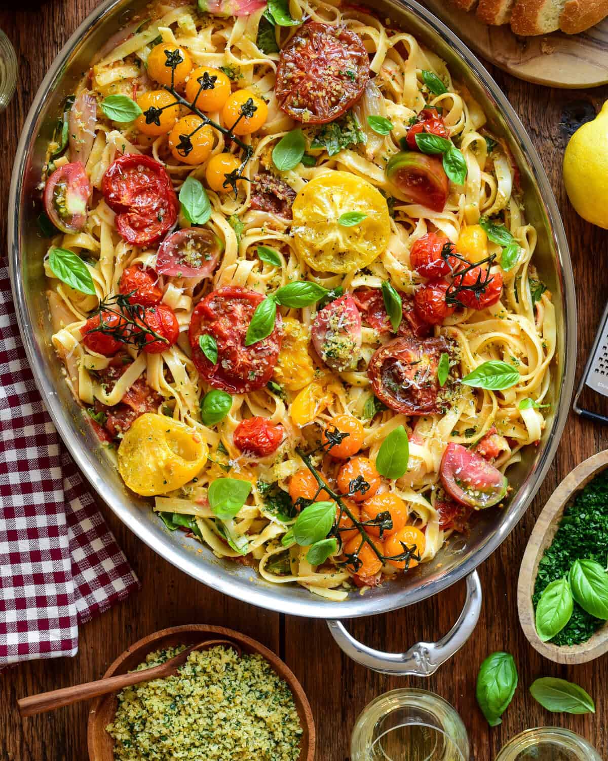 A large oval au gratin filled with a roasted heirloom tomato pasta with lemon-garlic panko and basil. Served with extra panko, lemon zest and extra herbs.