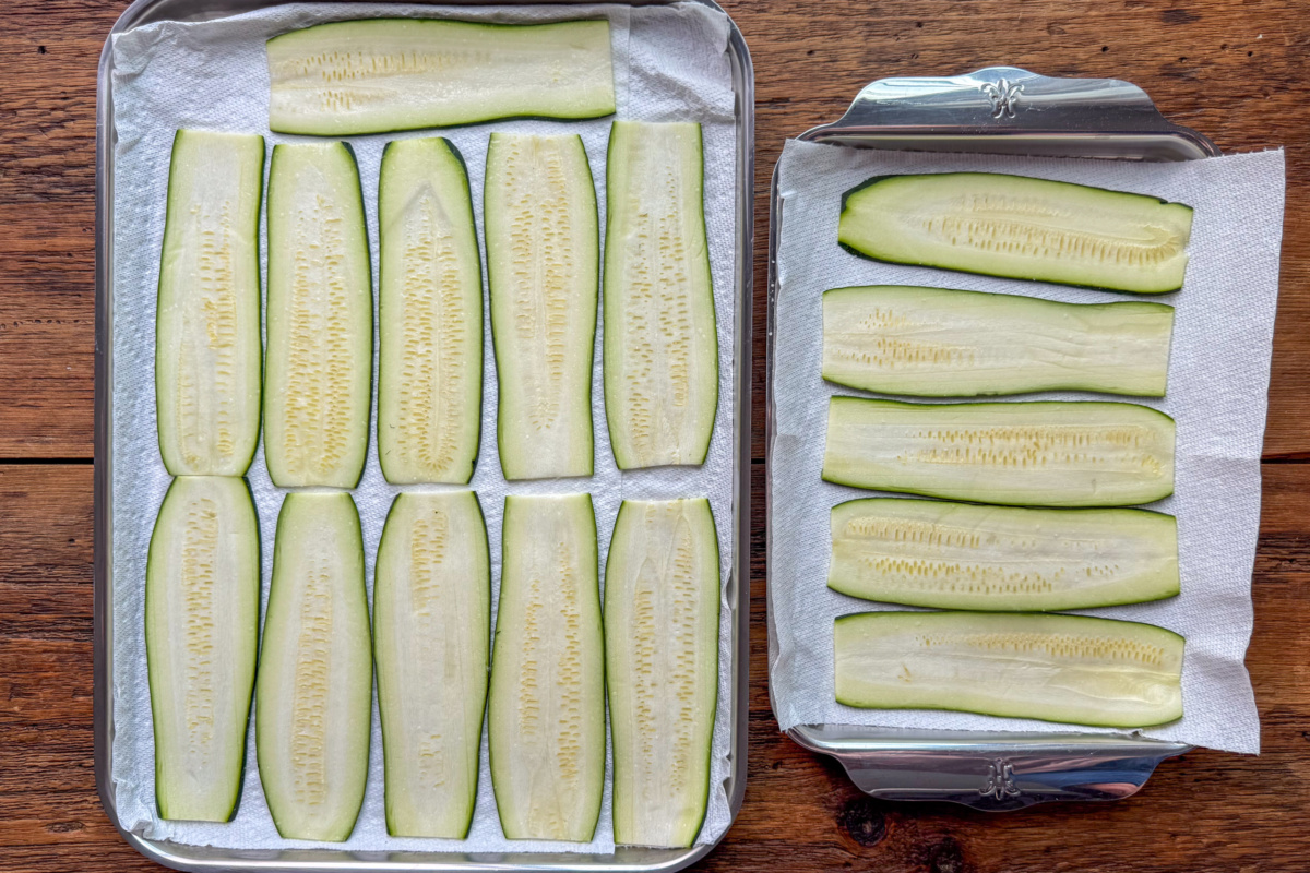 Thinly slice the zucchini, salt, and place on a sheet pan lined with paper towels.