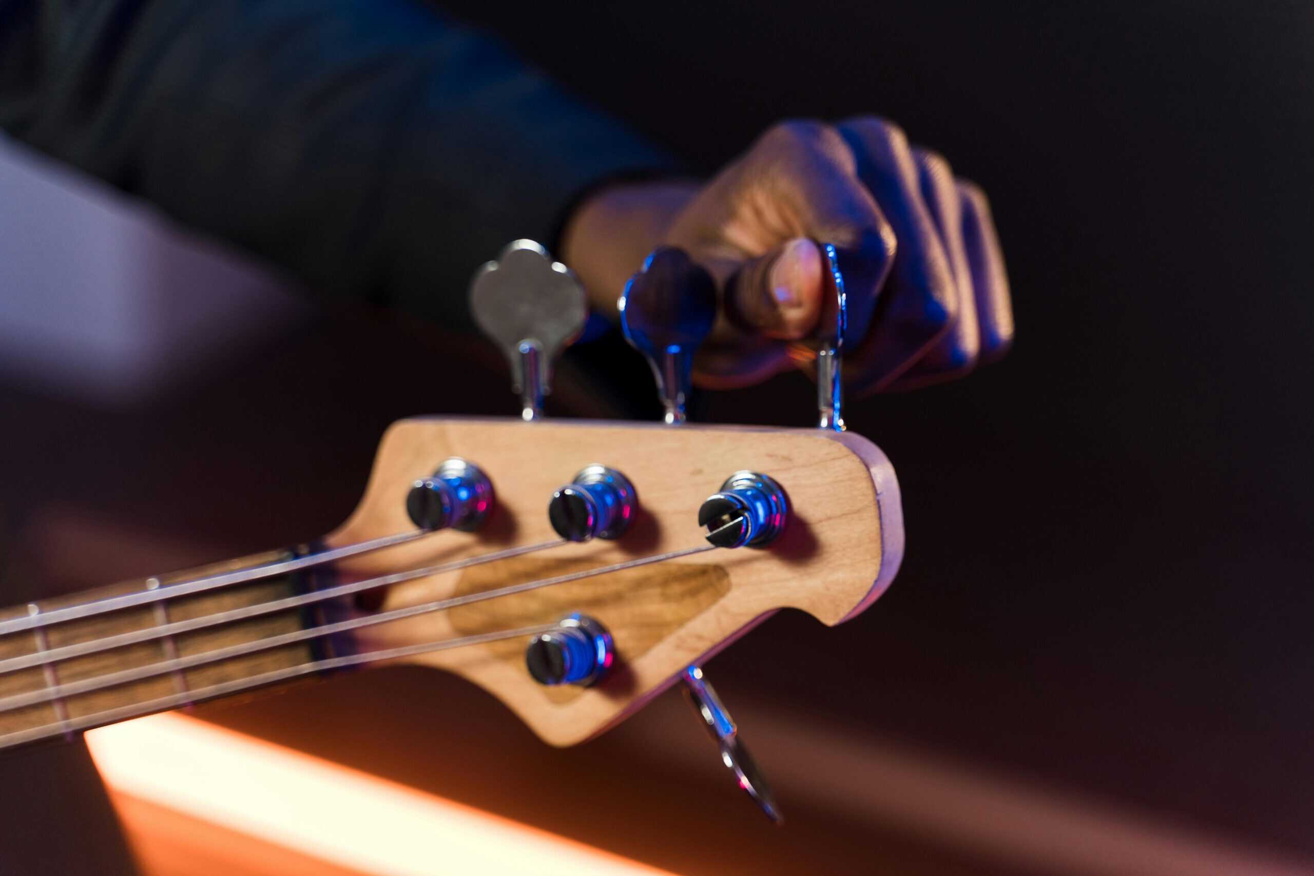 A bass guitar is tuned.