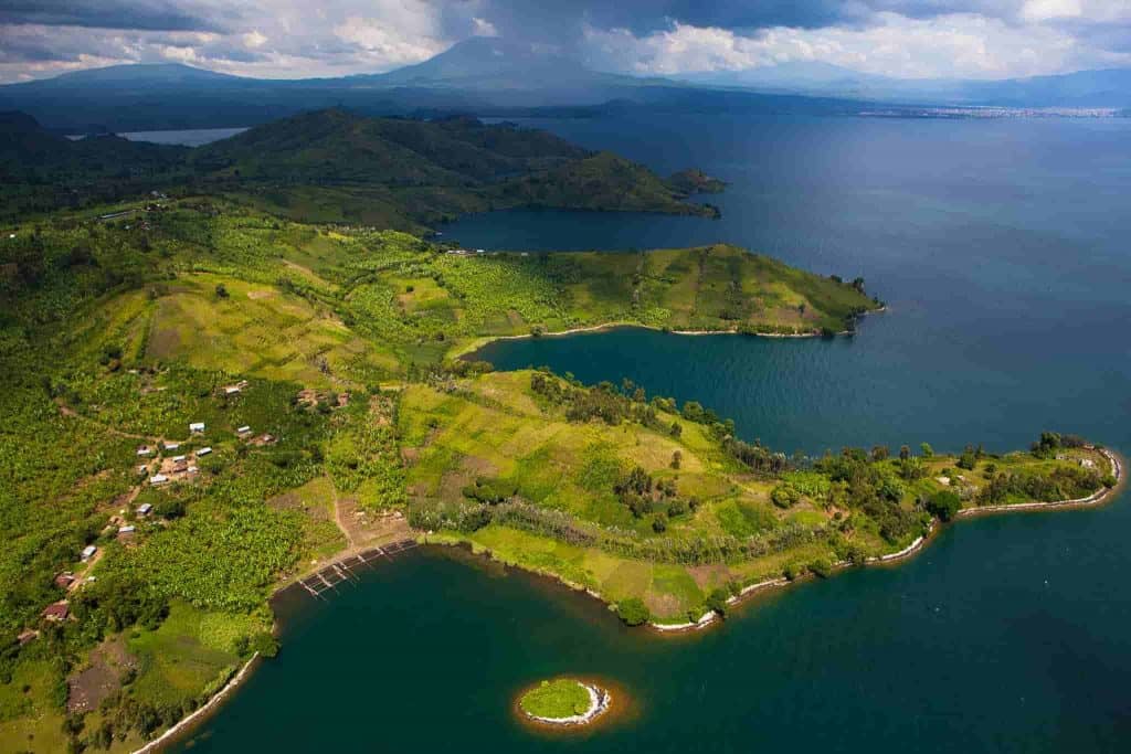 Aerial view of lush green landscapes and lakes in the Democratic Republic of Congo, highlighting key.