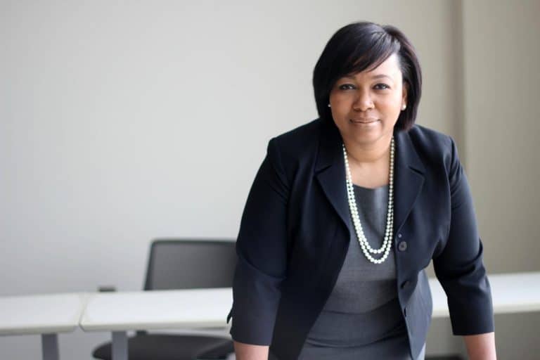 African woman leader in business and governance, representing women's empowerment.